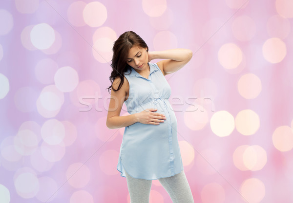 pregnant woman with neckache Stock photo © dolgachov