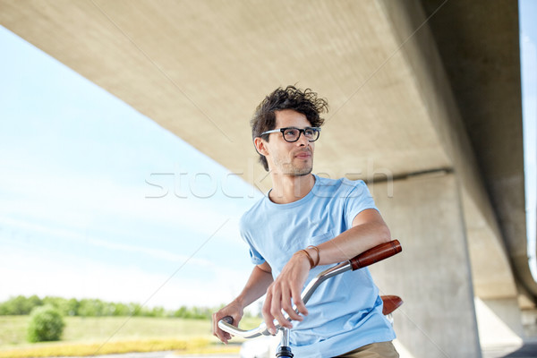 Jeunes homme équitation fixé engins [[stock_photo]] © dolgachov