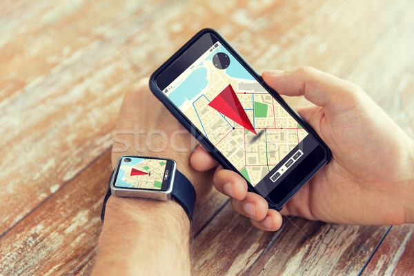 close up of hands with smart phone and watch Stock photo © dolgachov