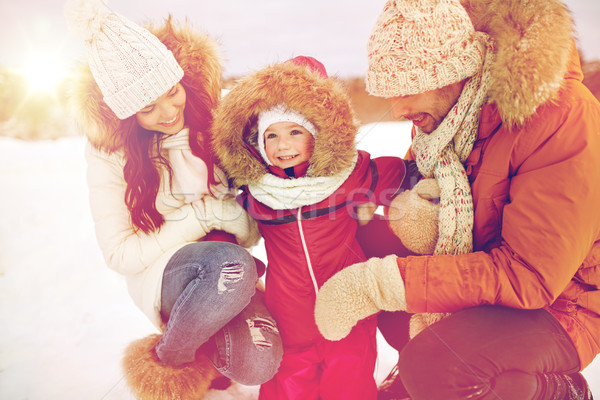 happy family with child in winter clothes outdoors Stock photo © dolgachov