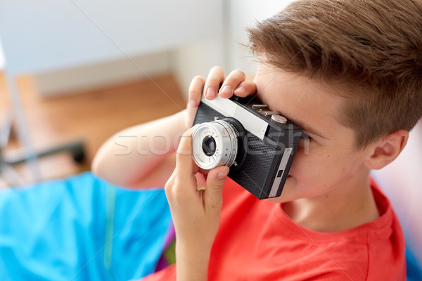 close up of boy photographing by film camera Stock photo © dolgachov
