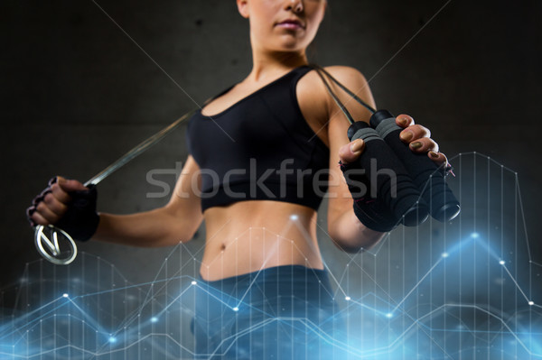 sporty woman with jumping rope Stock photo © dolgachov