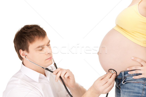 doctor and pregnant woman belly Stock photo © dolgachov