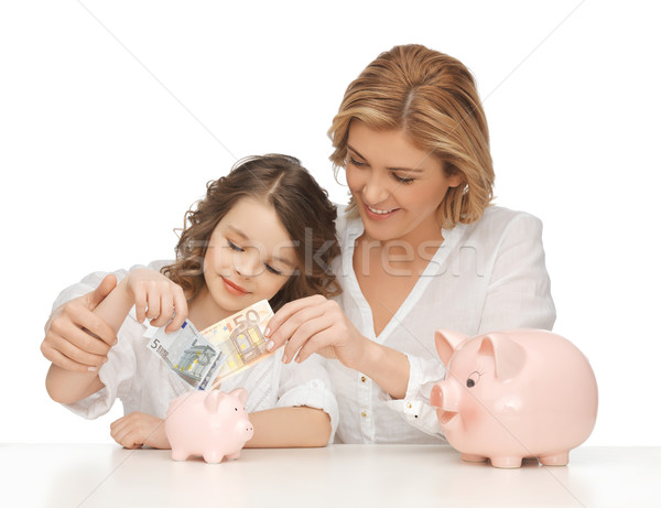 Anya lánygyermek malac bankok papír pénz Stock fotó © dolgachov