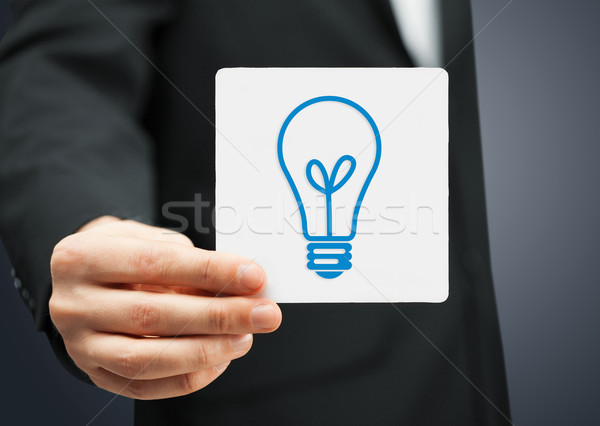sheet with sign of light bulb Stock photo © dolgachov