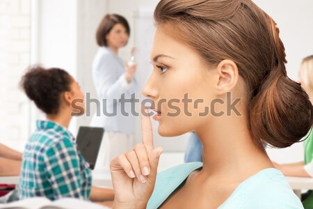 student making hush gesture at school Stock photo © dolgachov