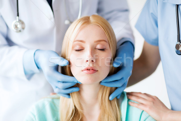plastic surgeon or doctor with patient Stock photo © dolgachov