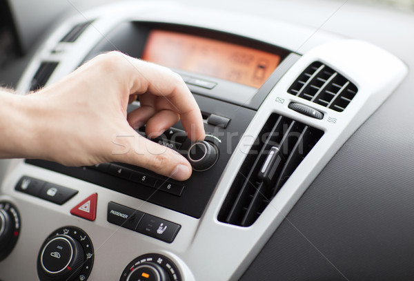Stock photo: man using car audio stereo system