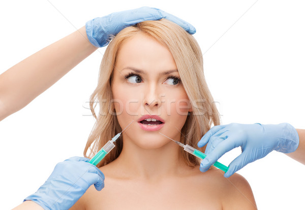 Vrouw gezicht handen schoonheid cosmetische chirurgie vrouw meisje Stockfoto © dolgachov