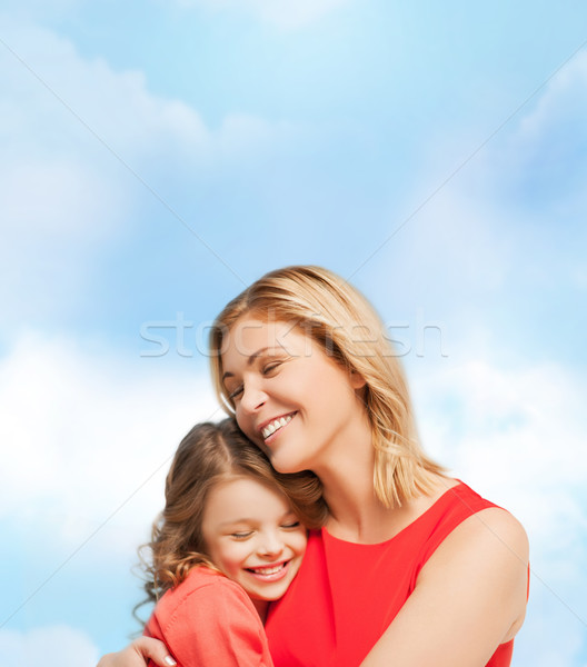 hugging mother and daughter Stock photo © dolgachov