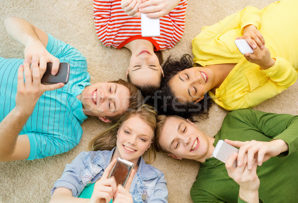 Csoport mosolyog emberek fekszik padló oktatás Stock fotó © dolgachov