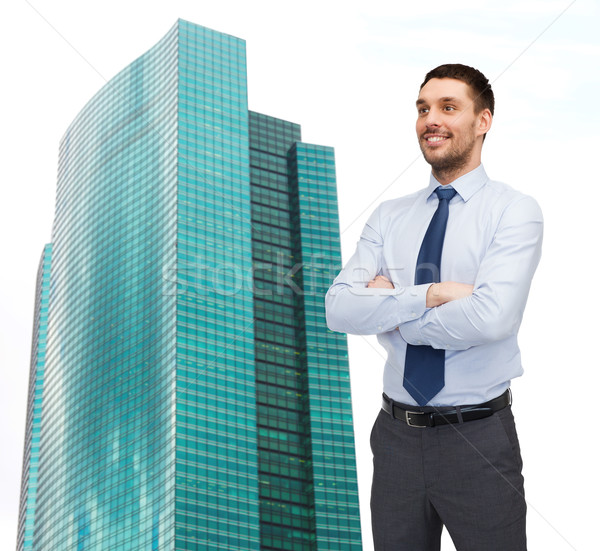 Stock photo: handsome businessman with crossed arms