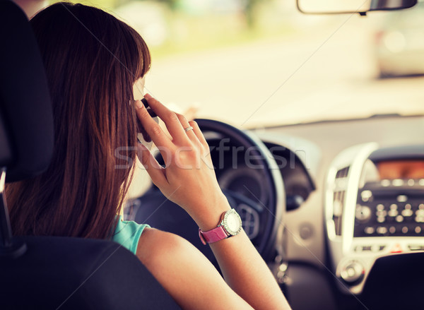 woman using phone while driving the car Stock photo © dolgachov