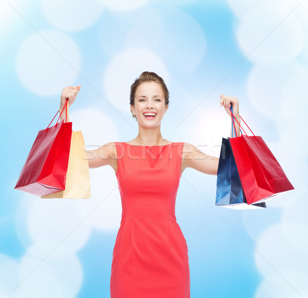 ストックフォト: 笑い · エレガントな · 女性 · ドレス · ショッピングバッグ · ショッピング