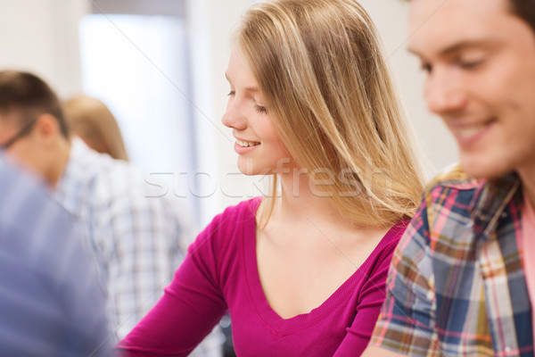 Stock photo: group of smiling students in lecture hall