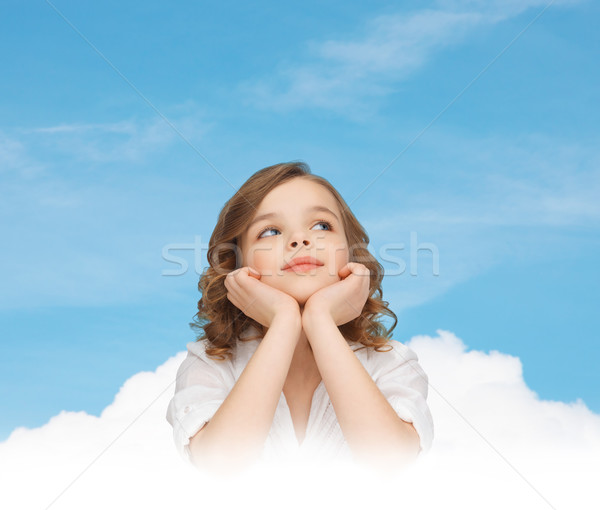 beautiful girl sitting at table and looking up Stock photo © dolgachov