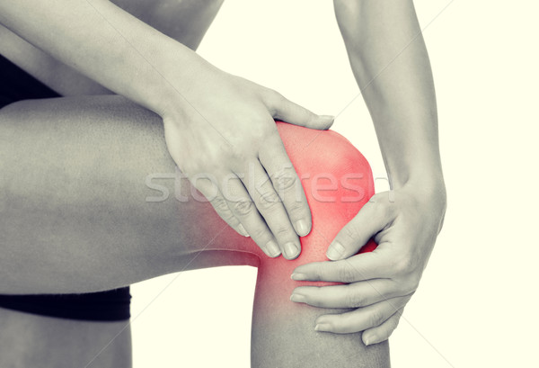 Kobiet ręce kolano fitness Zdjęcia stock © dolgachov