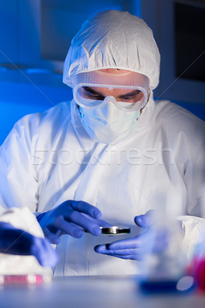 close up of male scientist with test sample in lab Stock photo © dolgachov