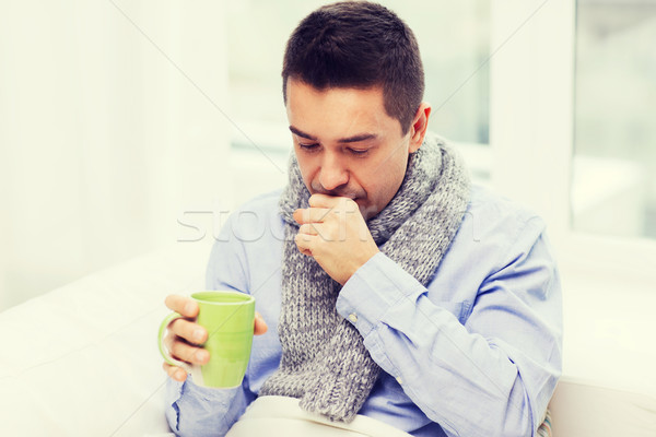 Hasta adam grip içme çay öksürük Stok fotoğraf © dolgachov