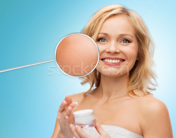 happy woman with cream jar Stock photo © dolgachov