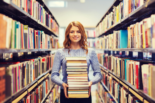 Foto stock: Feliz · estudante · menina · mulher · livros · biblioteca
