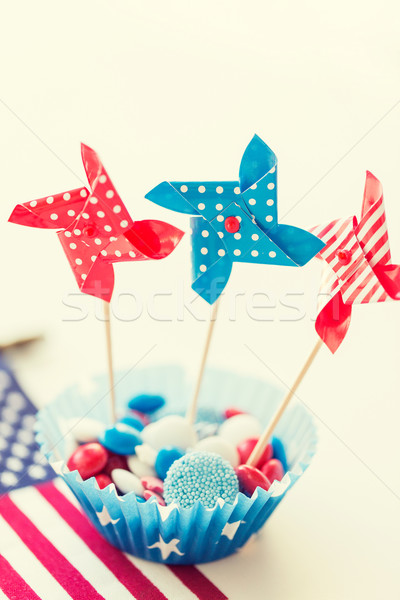candies with pinwheel toys on independence day Stock photo © dolgachov