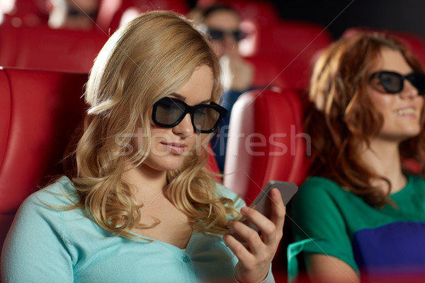 happy woman with smartphone in 3d movie theater Stock photo © dolgachov
