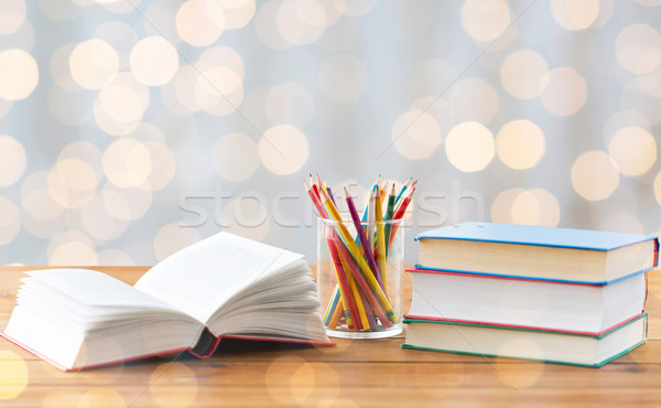 close up of crayons or color pencils and books Stock photo © dolgachov