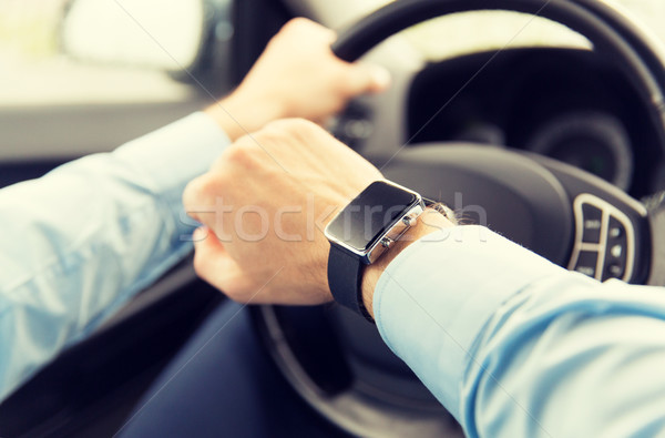 Közelkép férfi karóra vezetés autó szállítás Stock fotó © dolgachov