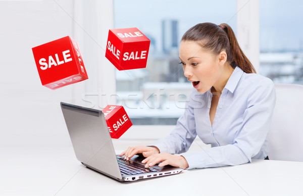 [[stock_photo]]: étonné · femme · d'affaires · portable · vente · signes · gens · d'affaires