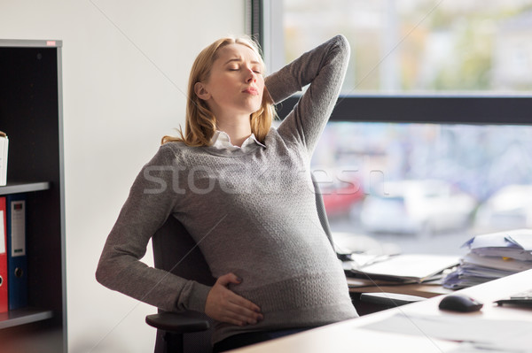 Obosit gravidă femeie de afaceri munca de birou sarcină afaceri Imagine de stoc © dolgachov
