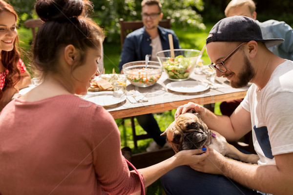 happy friends having dinner at summer garden party Stock photo © dolgachov