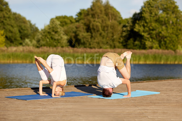 couple making yoga outdoors Stock photo © dolgachov