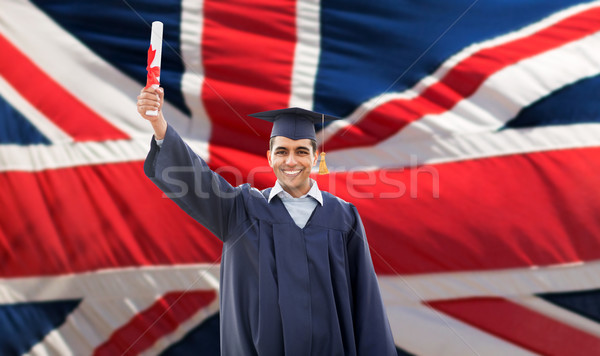 happy male student with diploma over british flag  Stock photo © dolgachov