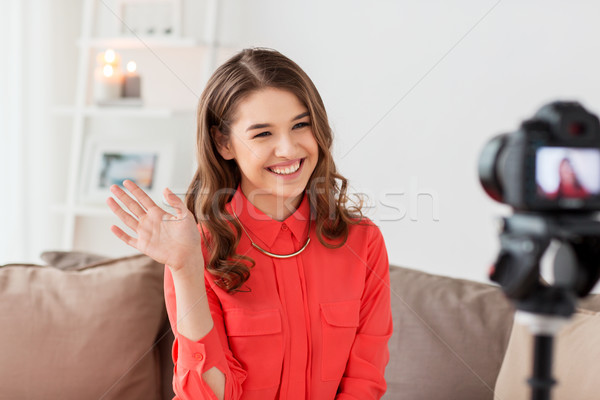 happy woman with camera recording video at home Stock photo © dolgachov