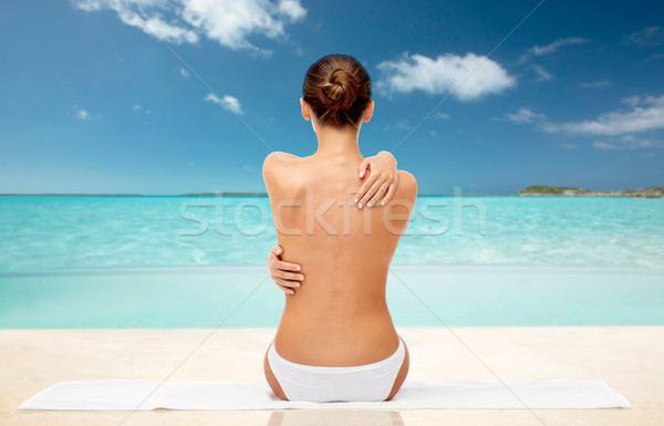 beautiful topless woman with towel on summer beach Stock photo © dolgachov