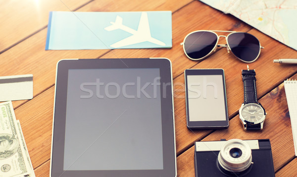 close up of smartphone and travel stuff Stock photo © dolgachov