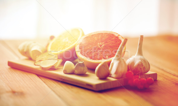 citrus, ginger, garlic and rowanberry on wood Stock photo © dolgachov