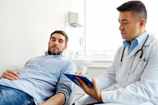 doctor and man with health problem at hospital Stock photo © dolgachov