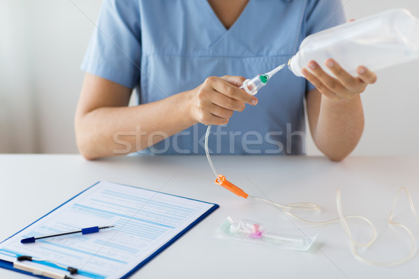 close up of nurse preparing drop counter Stock photo © dolgachov