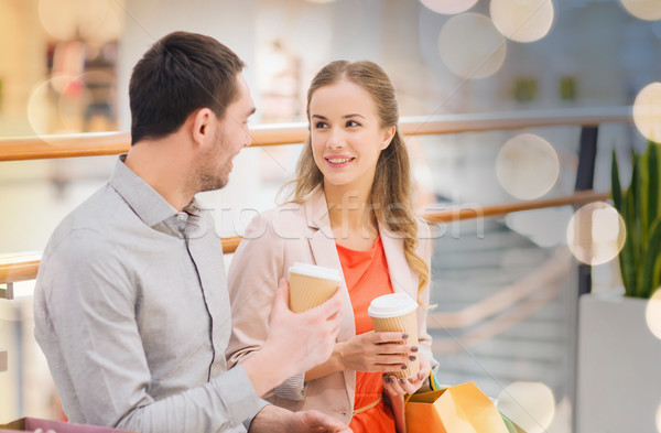 happy couple with shopping bags drinking coffee Stock photo © dolgachov