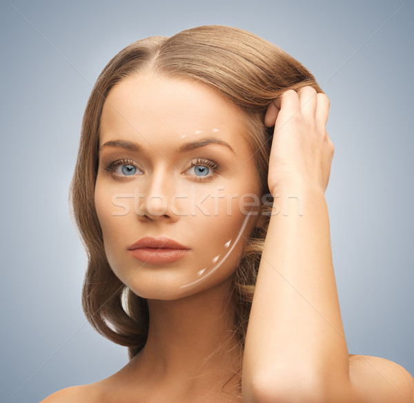 face and hands of beautiful woman Stock photo © dolgachov