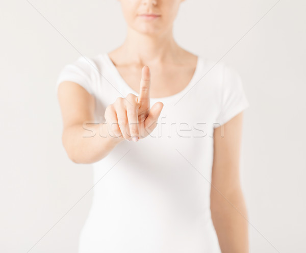 woman with finger up Stock photo © dolgachov