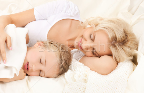 mother and daughter sleeping Stock photo © dolgachov