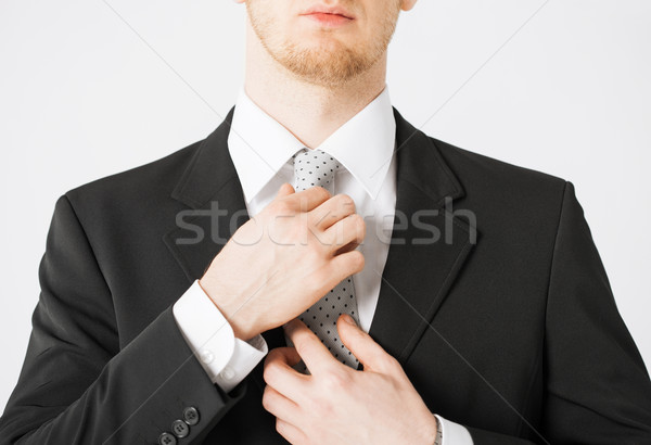 man adjusting his tie Stock photo © dolgachov