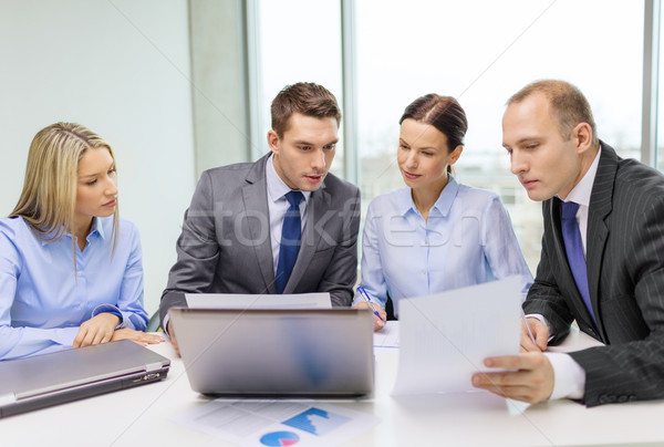 business team with laptop having discussion Stock photo © dolgachov