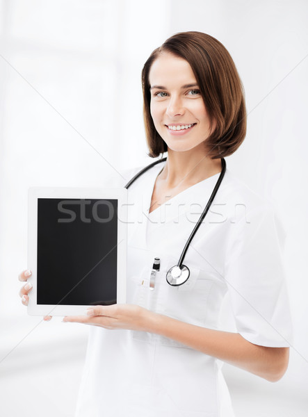 female doctor with tablet pc Stock photo © dolgachov