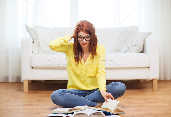 stressed student girl reading books at home Stock photo © dolgachov