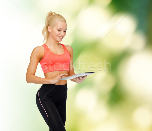 Sorridente mulher computador esportes Foto stock © dolgachov