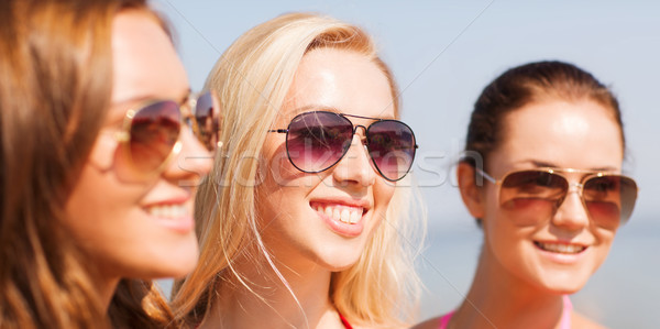 close up of smiling young women in sunglasses Stock photo © dolgachov